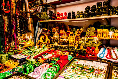 Hong Kong, China - 2 June, 2009: Ornate trinkets and carved items for sale at the Jade Market in Yau Ma Tei district in Kowloon during the daytimeの写真素材
