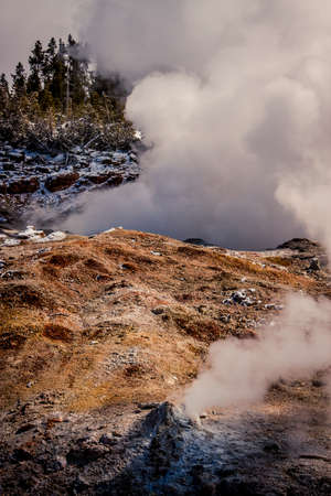 Geothermal vents with steam at Yellowstone National Parkの写真素材