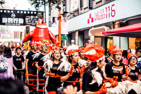 Taipei, Taiwan - 6 October, 2012: Masked creatures walking through the streets downtown during a parade to mark the anniversary of National Dayのeditorial素材