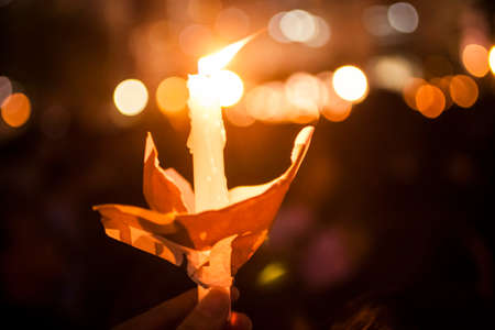 Light from a candle at a candlelight vigil for the victims of the Tianmen Square Massacre