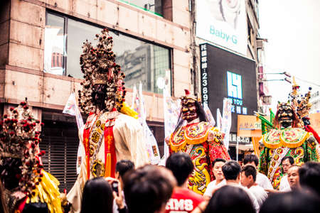 Taipei, Taiwan - 6 October, 2012: Masked creatures walking through the streets downtown during a parade to mark the anniversary of National Dayのeditorial素材