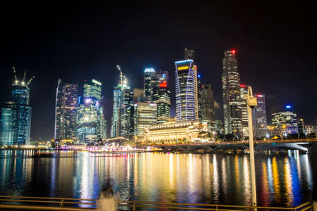 Singapore, Singapore - 19 May, 2010: Skyline of the city with the river at night