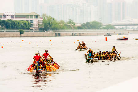 Hong Kong, China - 1 June, 2009: Dragonboat racing, a tradition in Chinese cultures, along the canals in Sha tin district in the New Territoriesのeditorial素材