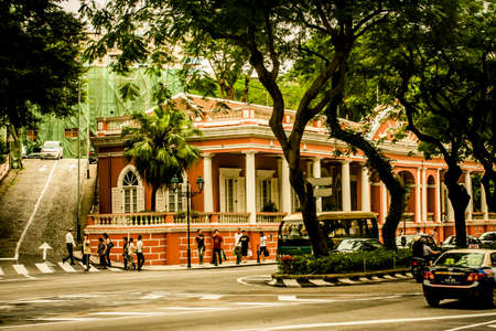 Macau, China - 9 June, 2009: Street scenes with local people along Rue de Campo in historic old town Macauのeditorial素材