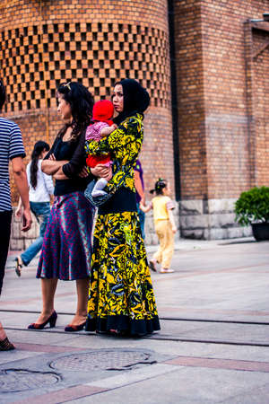 Urumqi, China - 23 June, 2009: Locals walking past the main mosque in the Islamic district of the cityのeditorial素材
