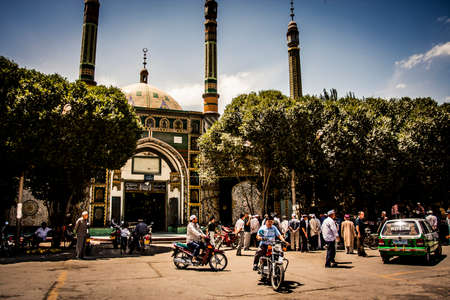 Makit, China - 30 June, 2009: Local mosque at the town center in Makit, bordering the Taklamakan desert on a sunny afternoonのeditorial素材