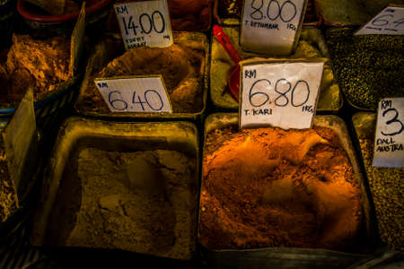 Piles of different varieties of curry at a marketの写真素材