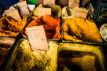 Piles of different varieties of curry at a marketの写真素材