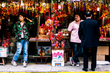 Hong Kong, China - 30 May, 2009: Shopkeepers waiting for customers in front of their stalls at Wong Tai Sin Templeのeditorial素材