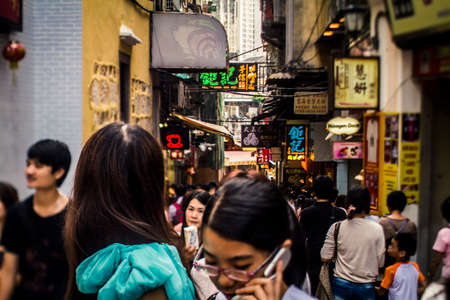 Macau, China - 3 September, 2011: Street scene with crowds of people in the colonial district of Macau during the daytimeのeditorial素材