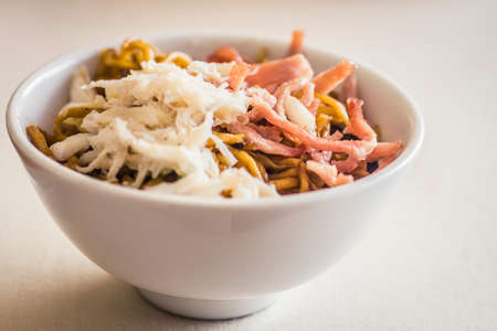 Dim Sum - Snow fish with noodles in a white bowl