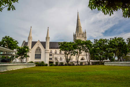 Singapore, Singapore - 6 January, 2017: View of the city skyline with Victoria Cathedral on a sunny afternoonのeditorial素材