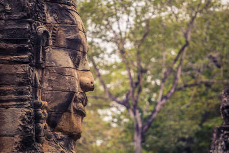Ancient Ruins at Bayon Temple in Angkor Watの写真素材
