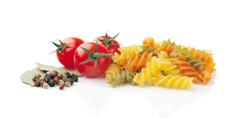 Pasta, Tomatoes, Peppercorn and Bay Leaves on White Backgroundの写真素材