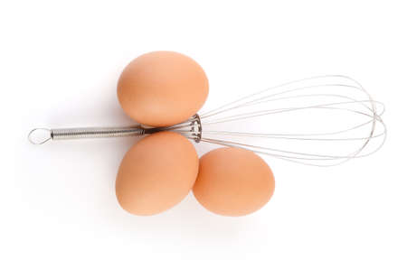 Whisk and Eggs on white background with clipping path