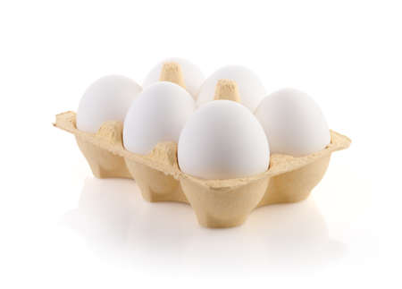 Six Eggs in carton on white with clipping pathの写真素材