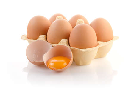 Eggs in carton on white with clipping pathの写真素材