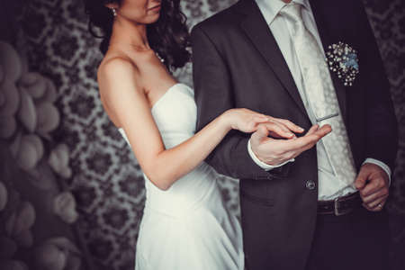 Wedding couple holding handsの写真素材