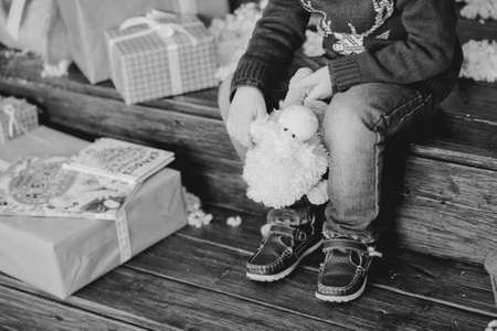 child sitting at the Christmas treeの写真素材