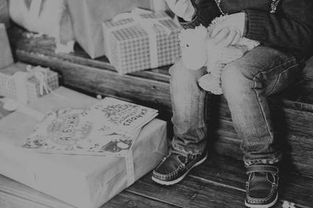child sitting at the Christmas treeの写真素材