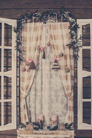 Frosted window with Christmas decorationの写真素材