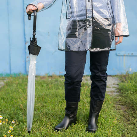 Woman with umbrella in the rainの写真素材