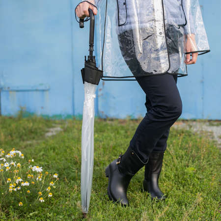 Woman with umbrella in the rainの写真素材