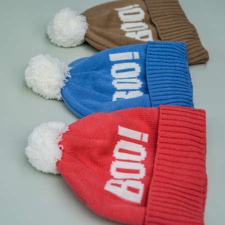 knitted caps with inscriptions in different colorsの写真素材