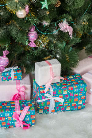 Beautifully decorated Christmas tree with many presents under it.の写真素材