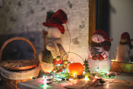 Wreath with snowman sitting on it with text Merry Christmas in vintage styleの写真素材