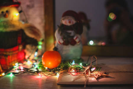 Wreath with snowman sitting on it with text Merry Christmas in vintage styleの写真素材