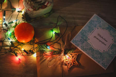 Wreath with snowman sitting on it with text Merry Christmas in vintage styleの写真素材