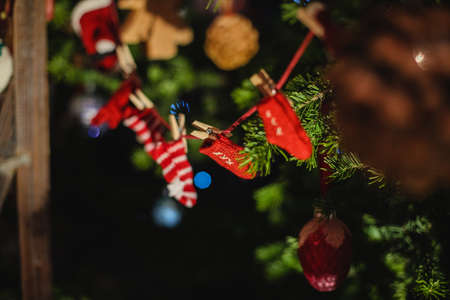 Decorated Christmas tree on  blurred, sparkling and fairy backgroundの写真素材