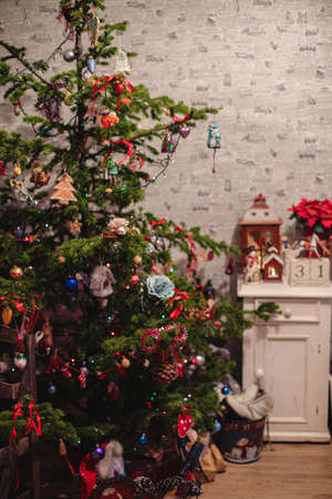 Decorated Christmas tree on  blurred, sparkling and fairy backgroundの写真素材