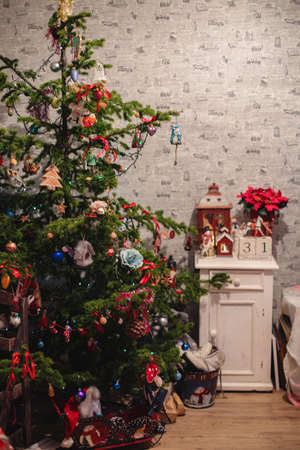 Decorated Christmas tree on  blurred, sparkling and fairy backgroundの写真素材