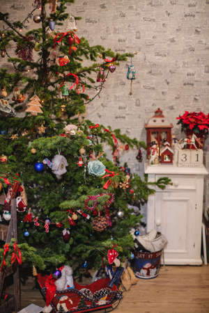 Decorated Christmas tree on  blurred, sparkling and fairy backgroundの写真素材