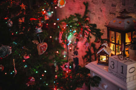 Decorated Christmas tree on  blurred, sparkling and fairy backgroundの写真素材