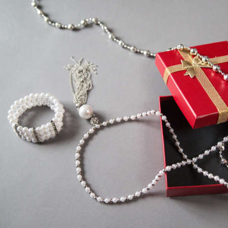 accessories and jewellery next to the red box on the backgroundの写真素材