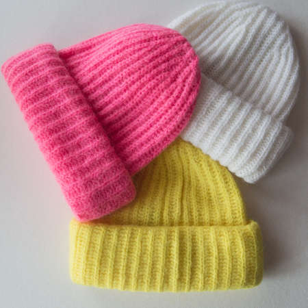 collection of knitted caps isolated on white background