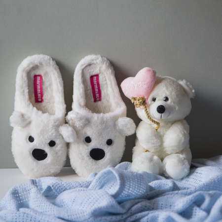 Slippers with muzzle hares are on the backgroundの写真素材