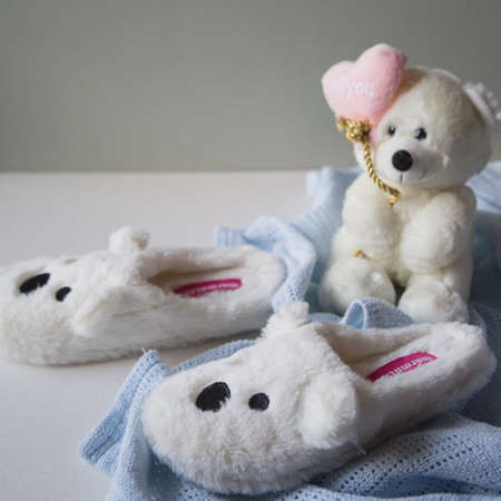 Slippers with muzzle hares are on the backgroundの写真素材