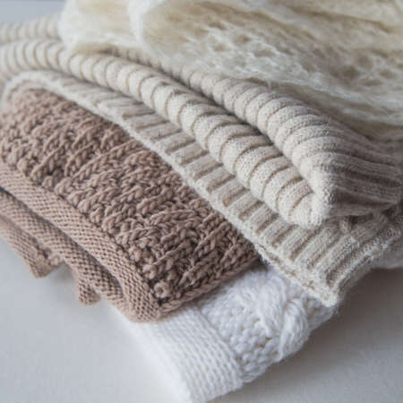 women's accessories, scarves lie on an isolated background