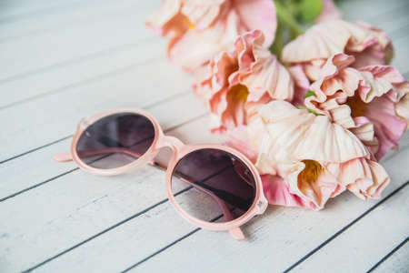 various women's accessories on wooden backgroundの写真素材