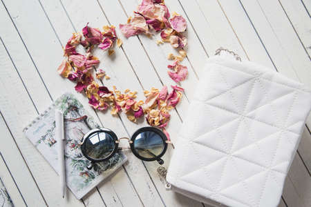 various women's accessories on wooden backgroundの写真素材