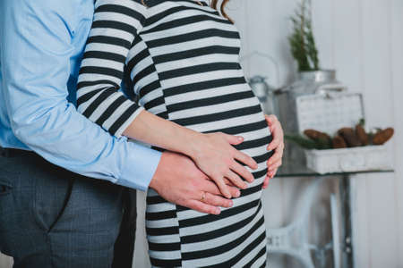 Beautiful elegant woman waiting a baby.
