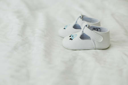 children's clothing and shoes on wooden backgroundの写真素材