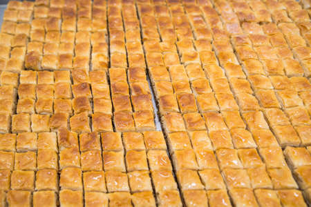 Baklava is a Middle-Eastern dessert. It is a rich, sweet pastry made of layers of filo filled with chopped nutsの写真素材