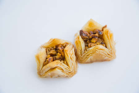 Baklava is a Middle-Eastern dessert. It is a rich, sweet pastry made of layers of filo filled with chopped nutsの写真素材