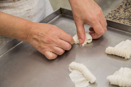 production of Oriental sweets with dough and flourの写真素材