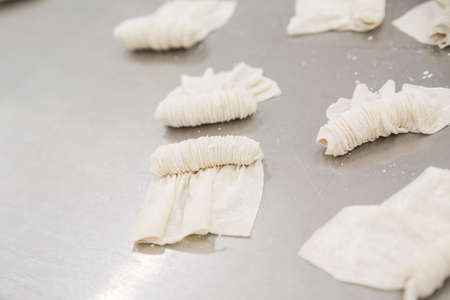 production of Oriental sweets with dough and flourの写真素材